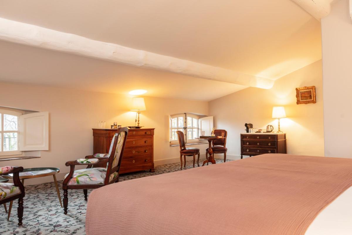 Un ou plusieurs lits dans un hébergement de l'établissement Hôtel - Restaurant & Spa La Magdeleine - Mathias Dandine