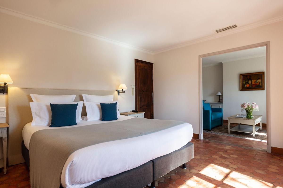 Un ou plusieurs lits dans un hébergement de l'établissement Hôtel - Restaurant & Spa La Magdeleine - Mathias Dandine