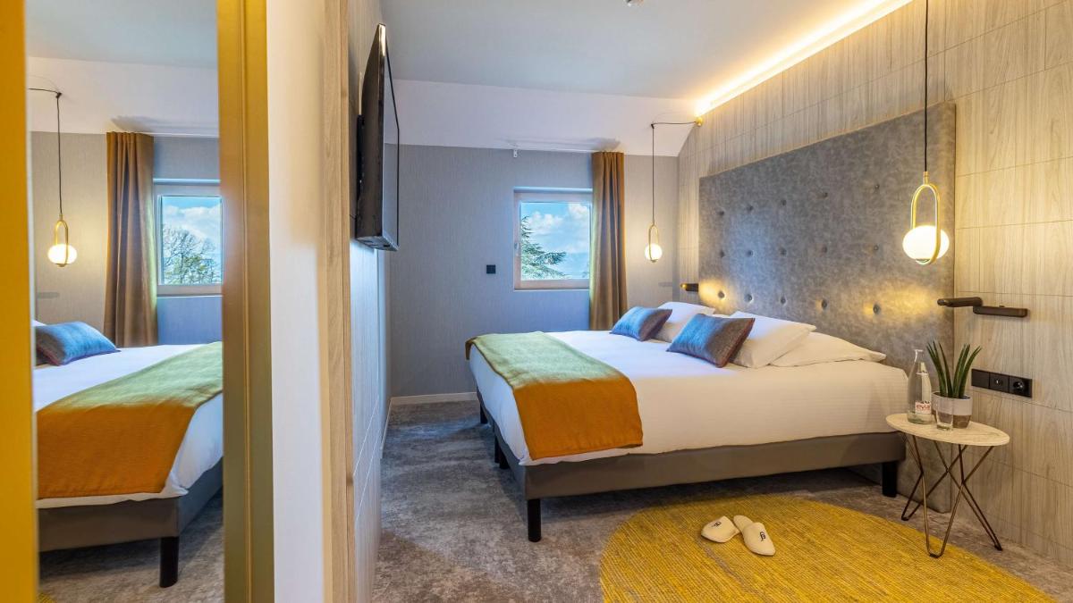 Un ou plusieurs lits dans un hébergement de l'établissement Domaine de Dolomieu Hotel & Spa - BW Premier Collection
