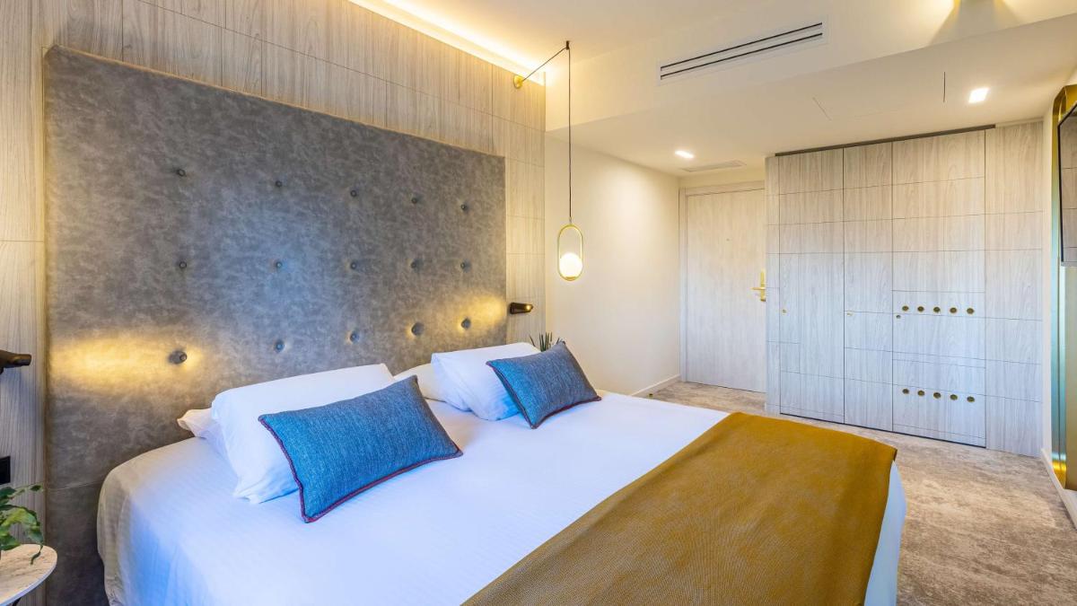 Un ou plusieurs lits dans un hébergement de l'établissement Domaine de Dolomieu Hotel & Spa - BW Premier Collection