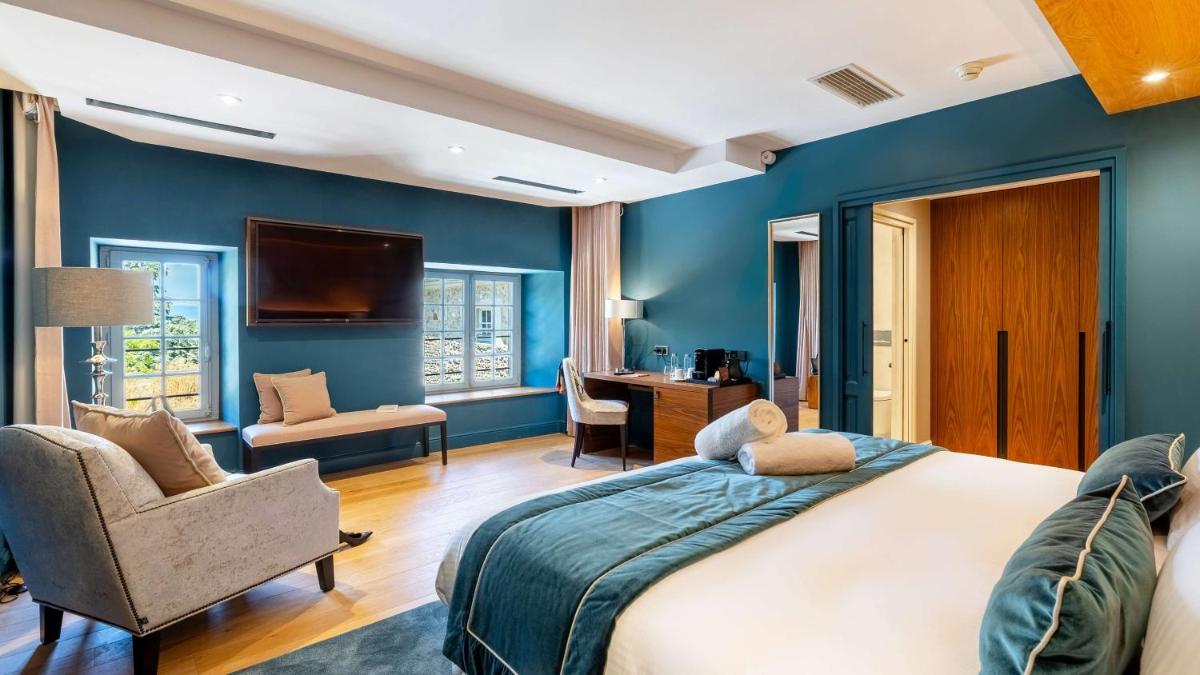 Un ou plusieurs lits dans un hébergement de l'établissement Domaine de Dolomieu Hotel & Spa - BW Premier Collection