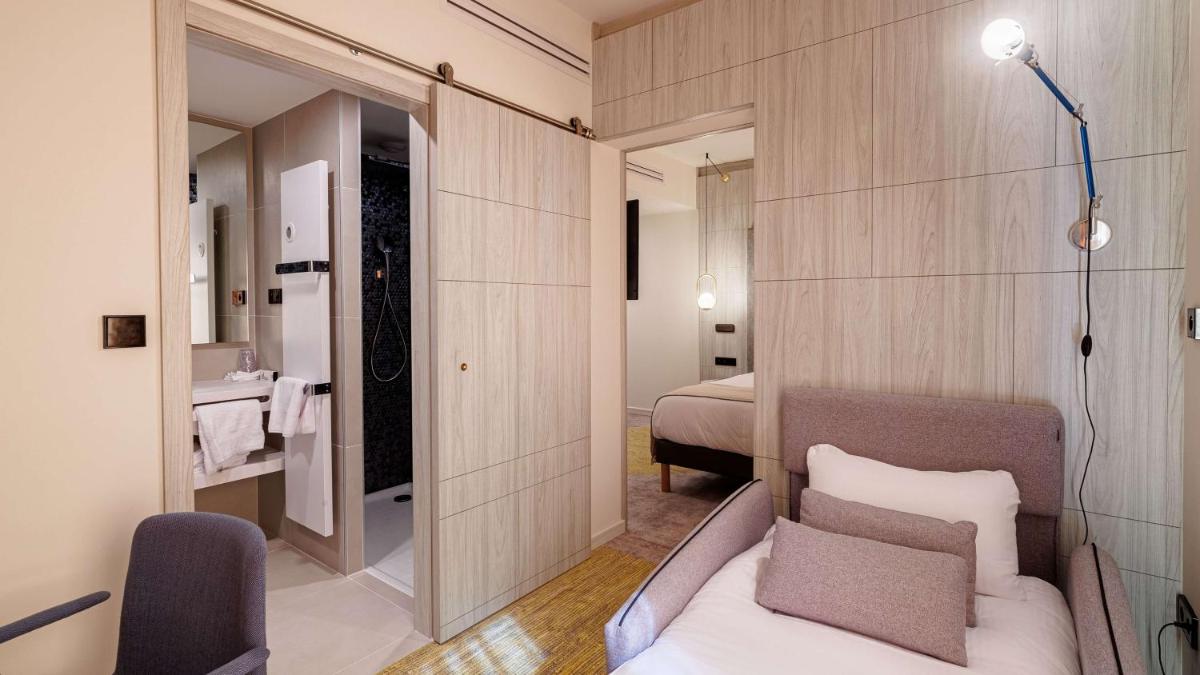 Un ou plusieurs lits dans un hébergement de l'établissement Domaine de Dolomieu Hotel & Spa - BW Premier Collection