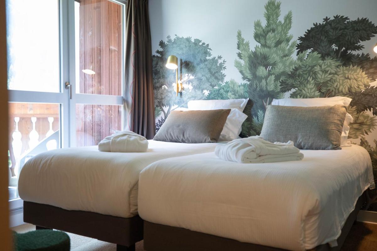 Un ou plusieurs lits dans un hébergement de l'établissement Lykke Hôtel & Spa Chamonix - ex Mercure