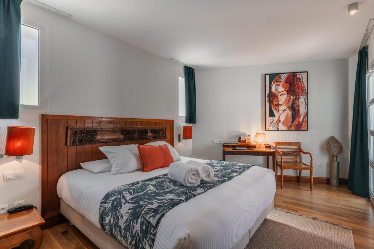 Un ou plusieurs lits dans un hébergement de l'établissement Villa Kerasy Hotel Spa
