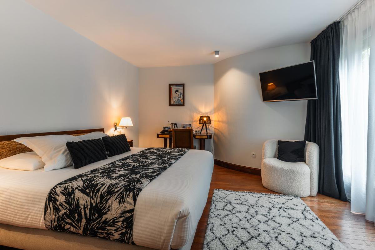Un ou plusieurs lits dans un hébergement de l'établissement Villa Kerasy Hotel Spa