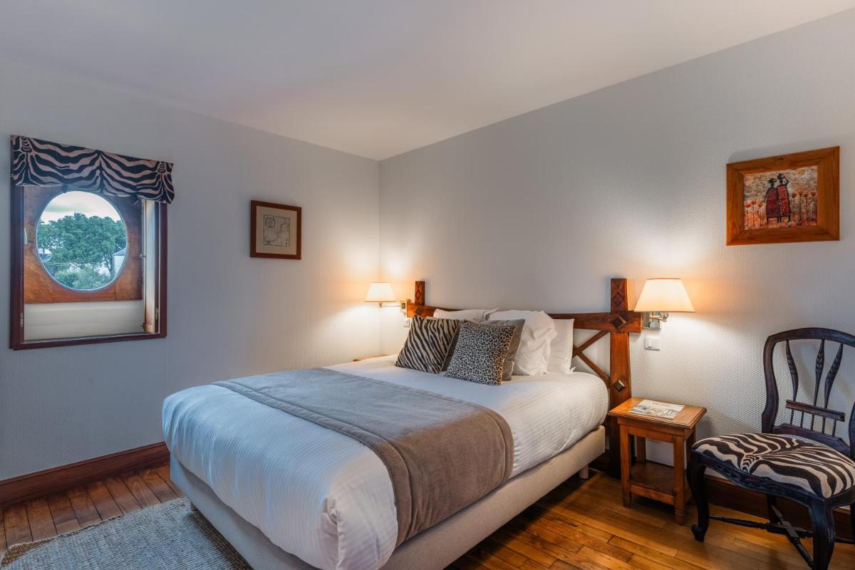 Un ou plusieurs lits dans un hébergement de l'établissement Villa Kerasy Hotel Spa