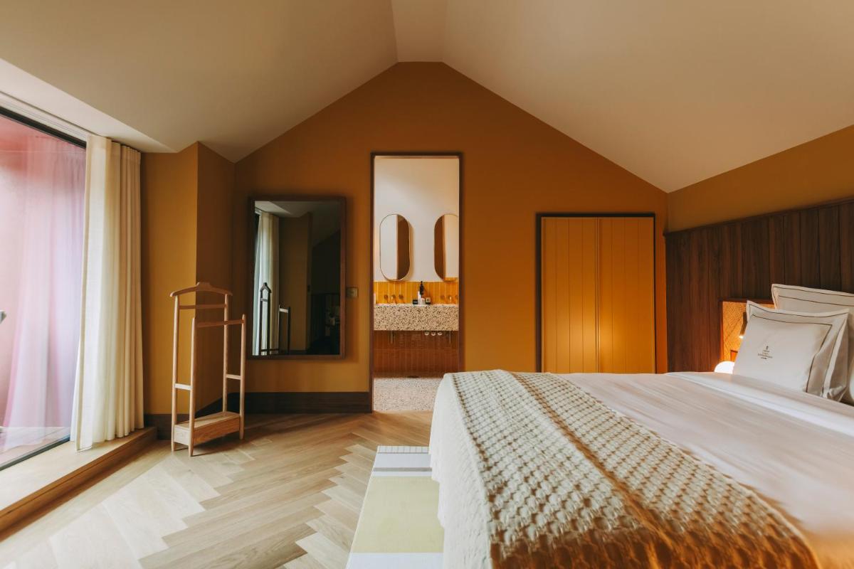 Uma cama ou camas num quarto em Torel Quinta da Vacaria - Douro Valley