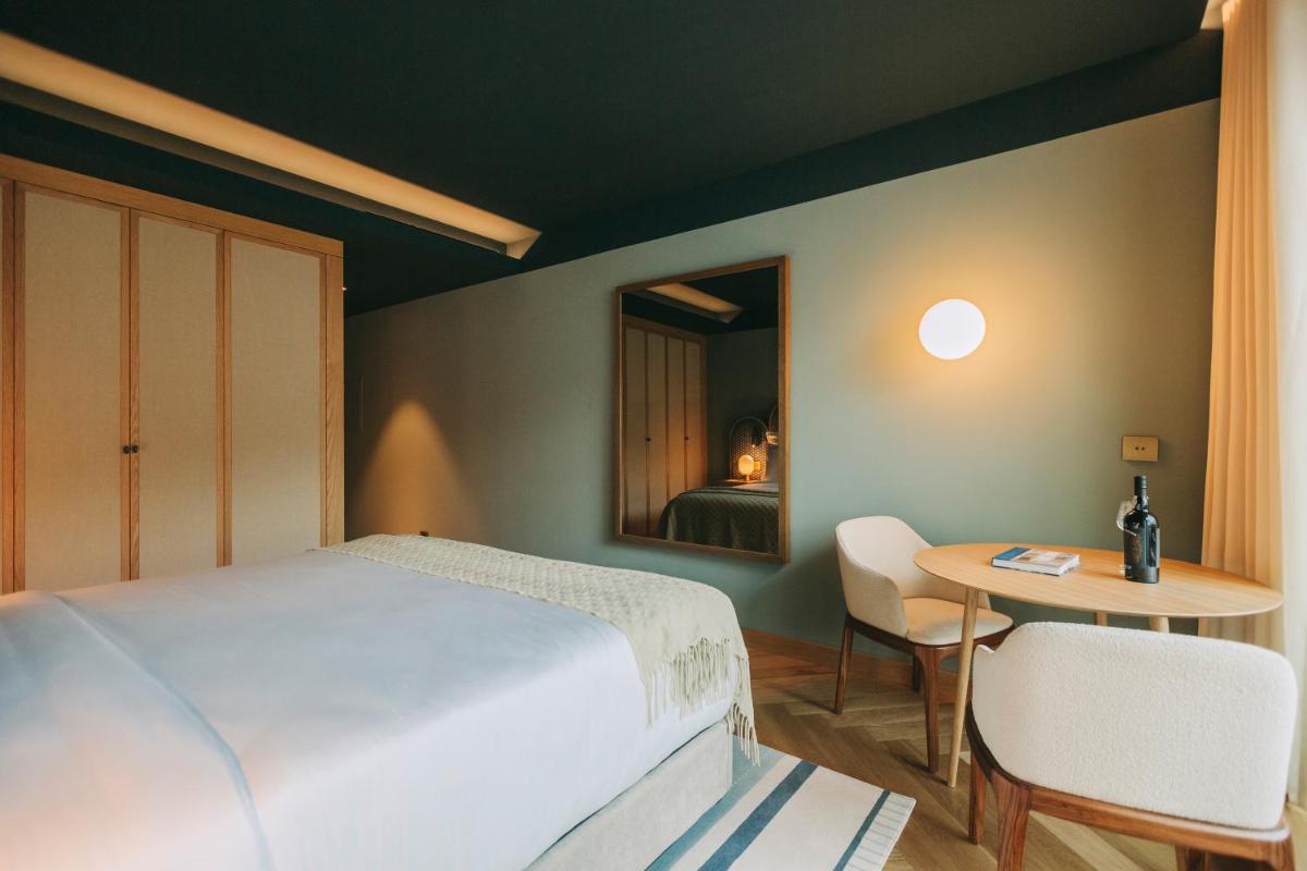 Uma cama ou camas num quarto em Torel Quinta da Vacaria - Douro Valley