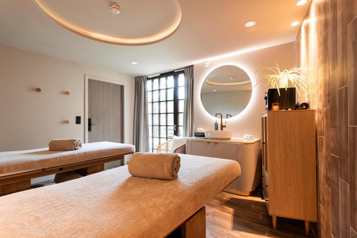 Un ou plusieurs lits dans un hébergement de l'établissement La Maison OBONO Hôtel & Spa