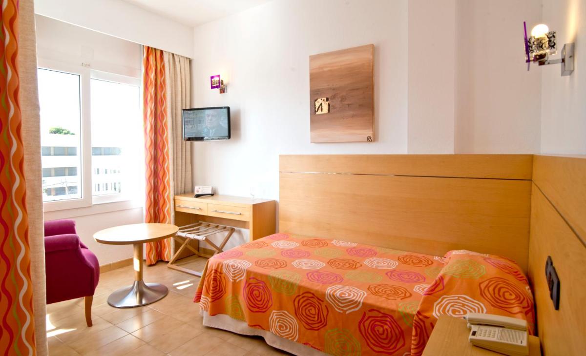 Cama o camas de una habitación en Hotel Capricho