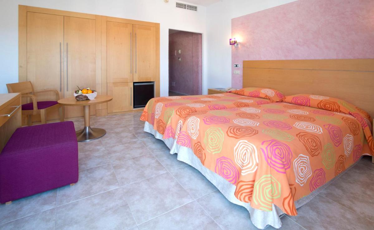 Cama o camas de una habitación en Hotel Capricho
