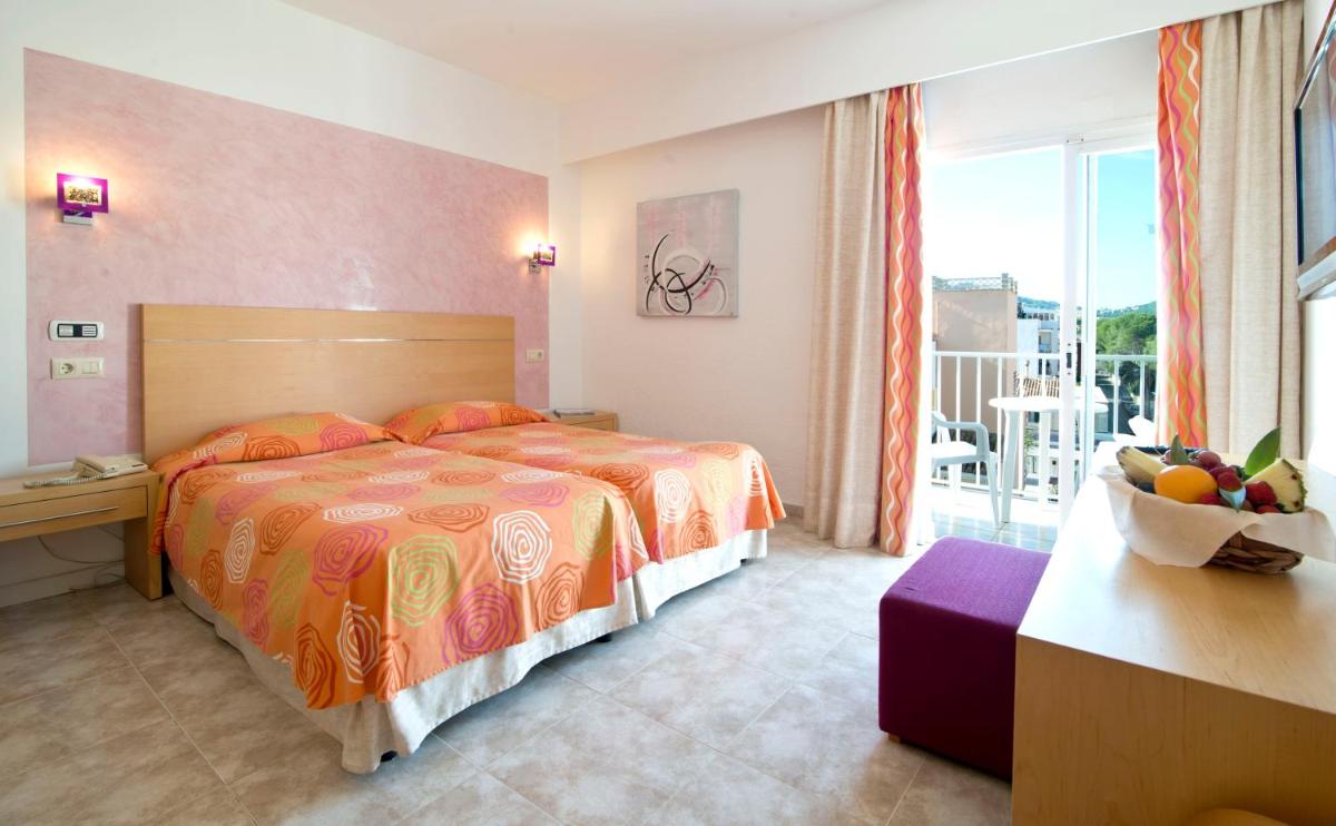 Cama o camas de una habitación en Hotel Capricho