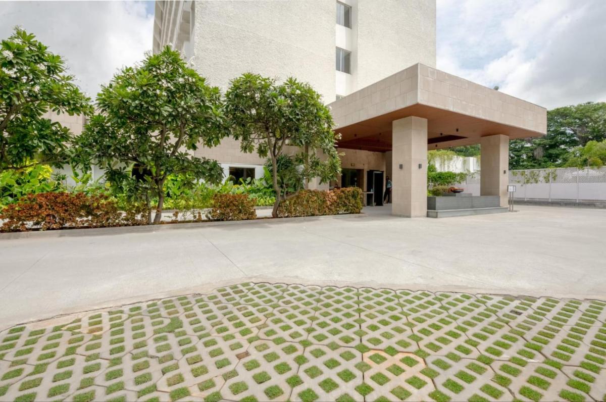 a building with a concrete floor in front of it at Southern Star,Mysore in Mysore