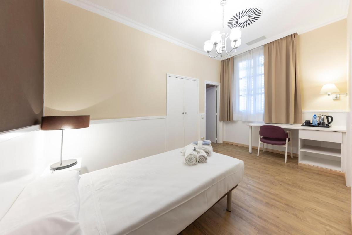 Cama o camas de una habitación en 1881 Hotel Balneario Vichy Catalan
