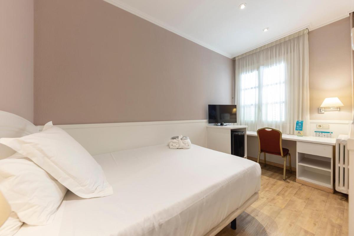 Cama o camas de una habitación en 1881 Hotel Balneario Vichy Catalan