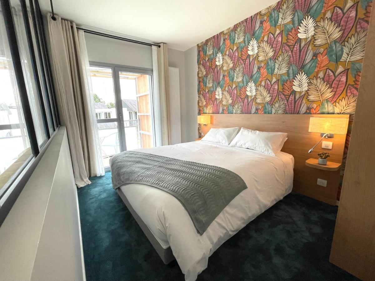 Un ou plusieurs lits dans un hébergement de l'établissement The Originals City, Ara Hôtel, Landerneau