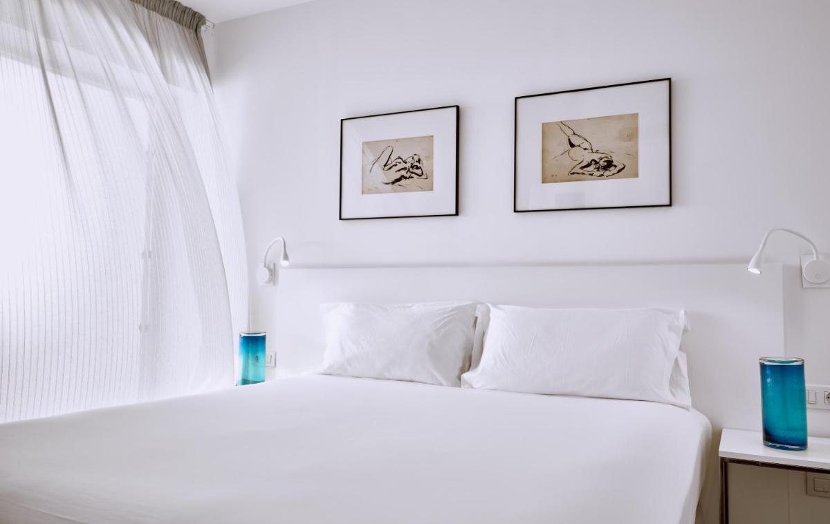 Cama o camas de una habitación en Hotel Baobab Suites