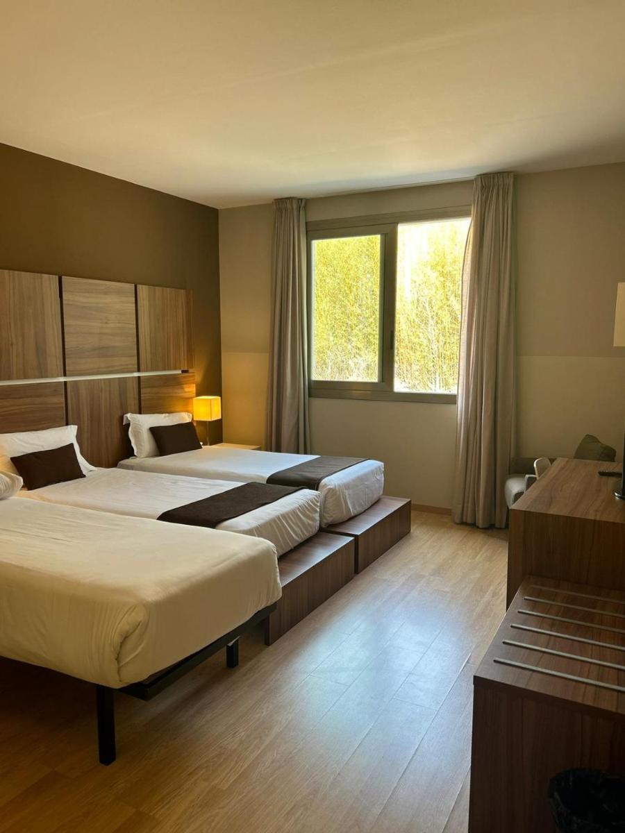 Cama o camas de una habitación en Hotel & Spa Golden Barcelona