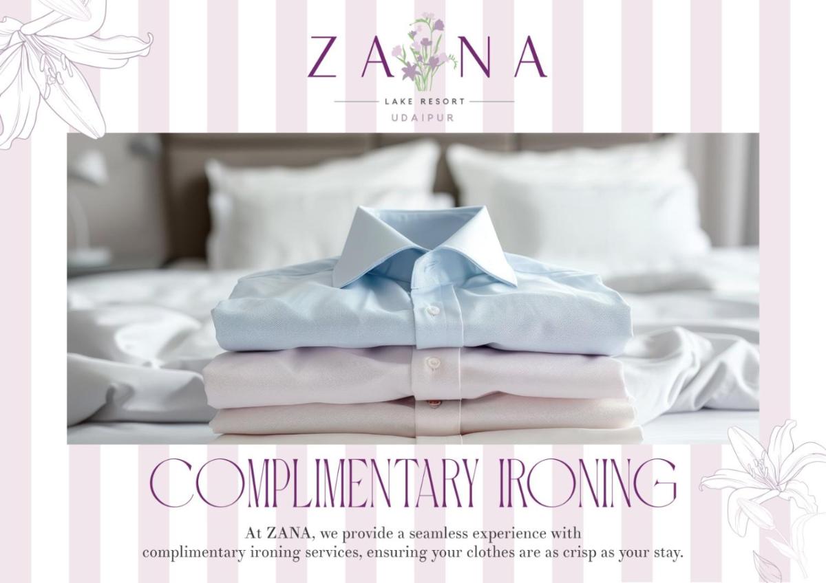 a poster of a bed with a pile of towels at ZANA Lakeview Resort - most scenic lakeside resort in Udaipur