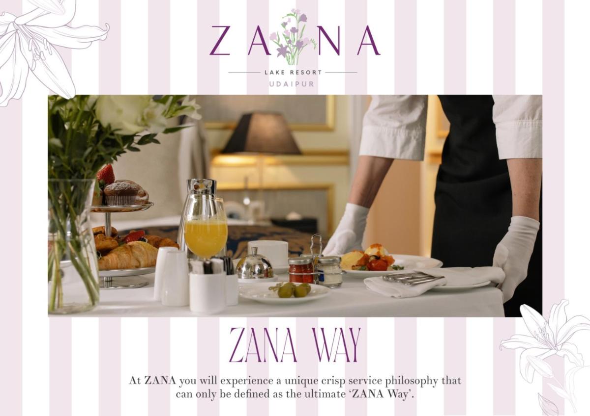 a person in a kitchen with a table with food at ZANA Lakeview Resort - most scenic lakeside resort in Udaipur