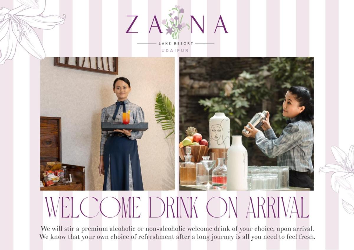 a woman standing next to a table with a drink at ZANA Lakeview Resort - most scenic lakeside resort in Udaipur