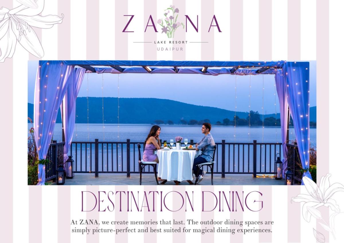 a man and woman sitting at a table under a tent at ZANA Lakeview Resort - most scenic lakeside resort in Udaipur