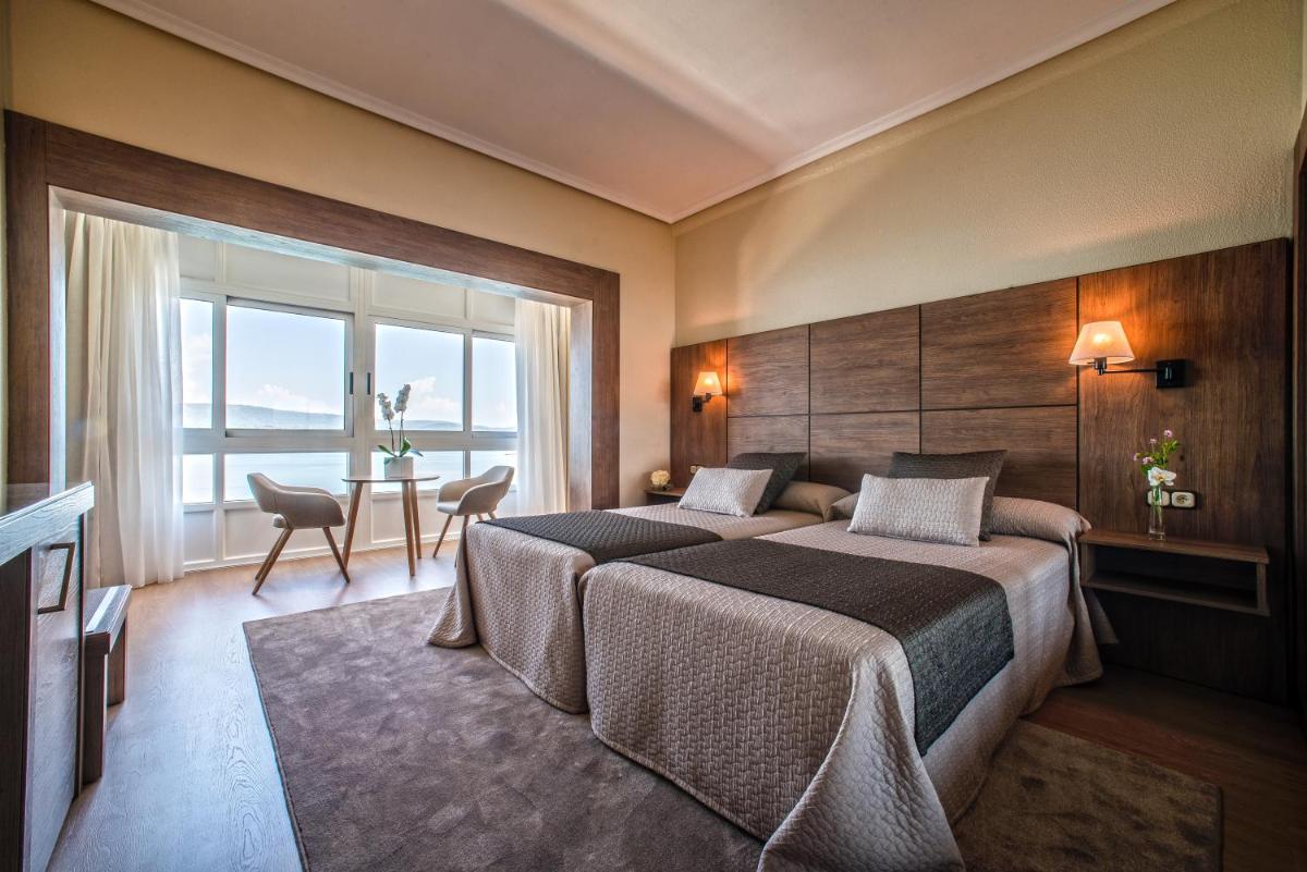 Cama o camas de una habitación en Eurostars Louxo Talaso