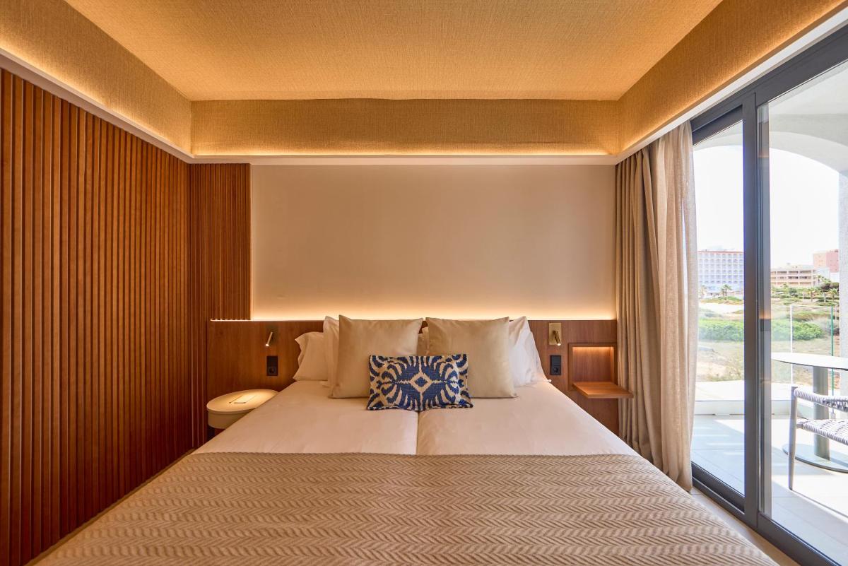 Cama o camas de una habitación en Universal Grand León & Spa