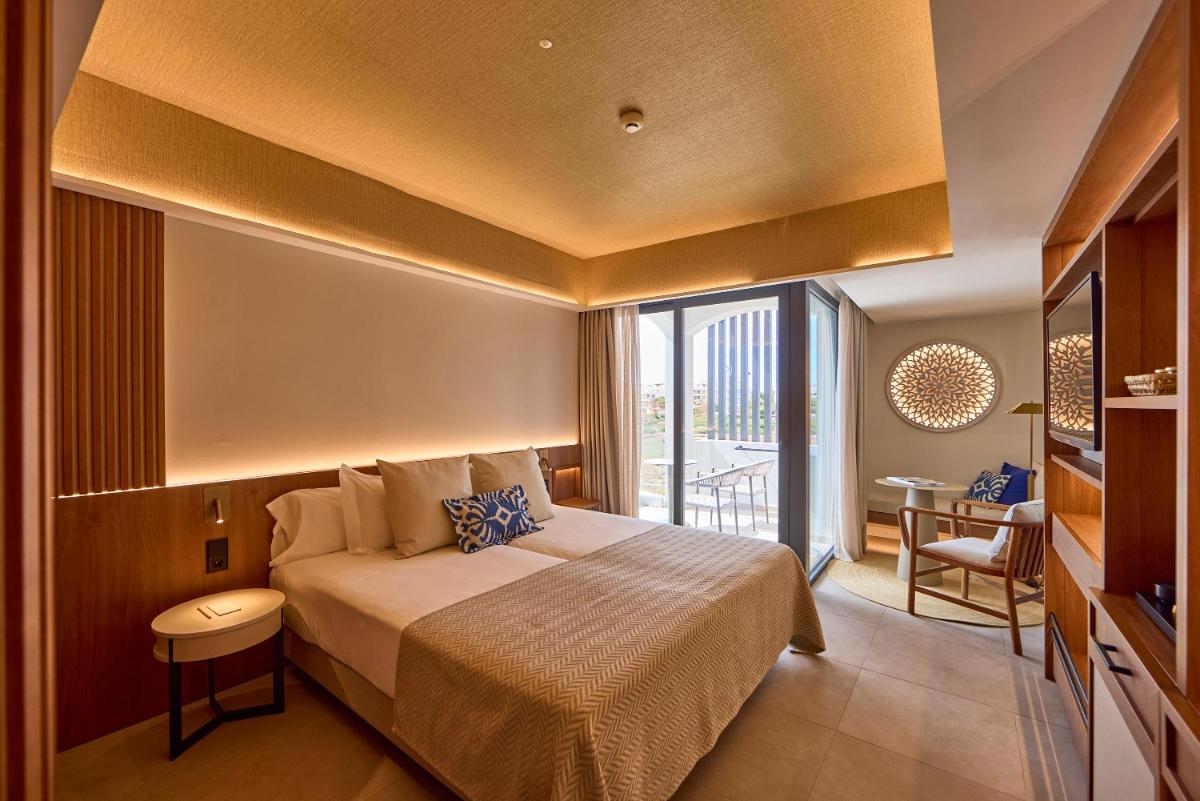 Cama o camas de una habitación en Universal Grand León & Spa
