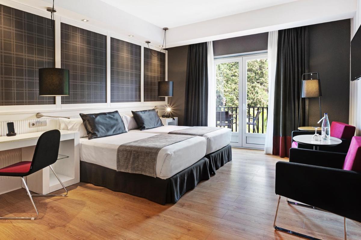 Cama o camas de una habitación en Catalonia Reina Victoria