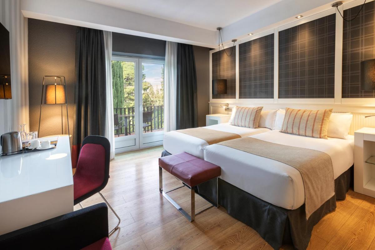 Cama o camas de una habitación en Catalonia Reina Victoria