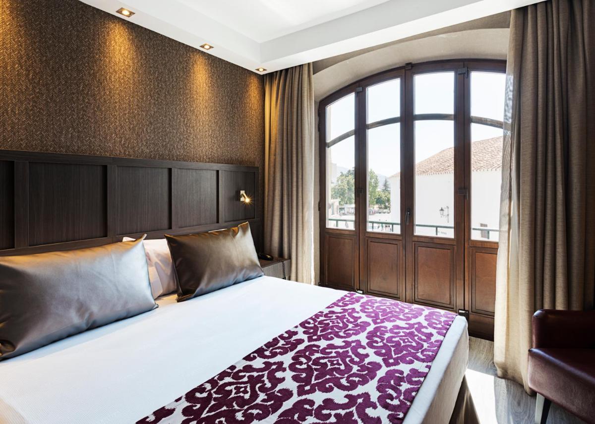 Cama o camas de una habitación en Catalonia Ronda