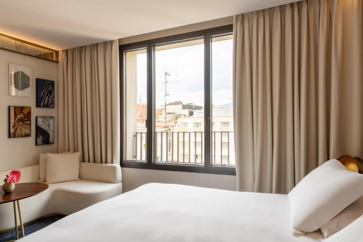 Cama o camas de una habitación en Almanac Barcelona