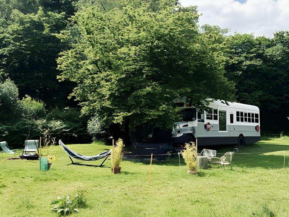 American School Bus Retreat with Hot Tub in Sussex Meadow - Housity
