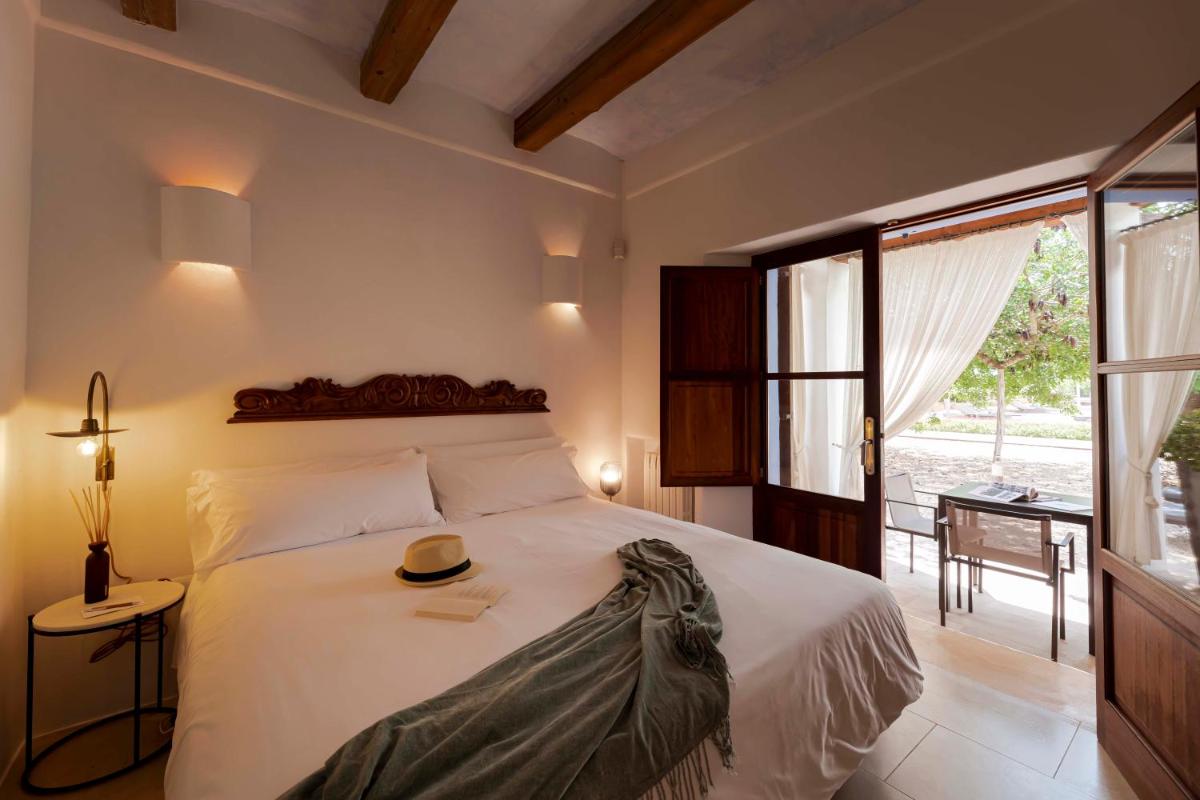 Cama o camas de una habitación en Ca Na Xica - Hotel & Spa