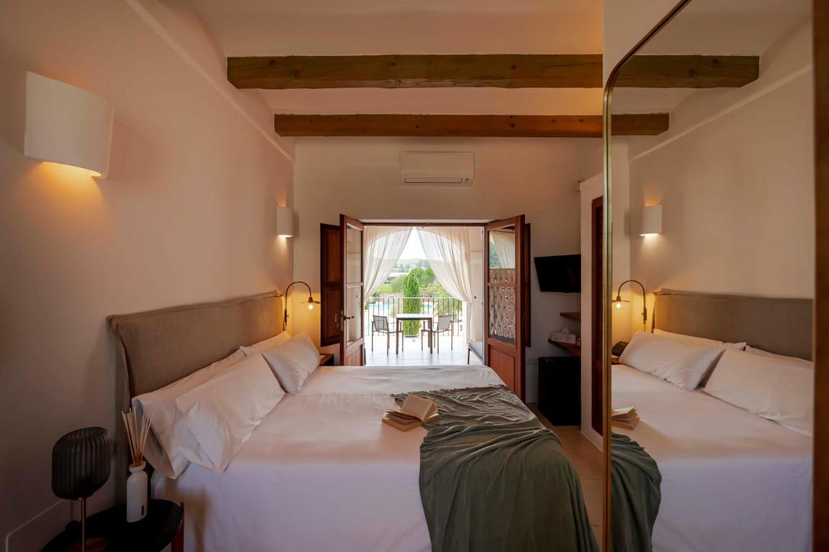 Cama o camas de una habitación en Ca Na Xica - Hotel & Spa