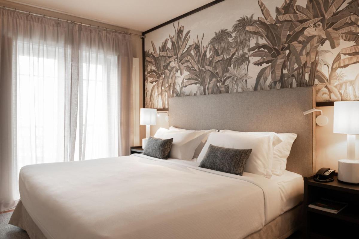 Uma cama ou camas num quarto em Domes Lake Algarve, Autograph Collection