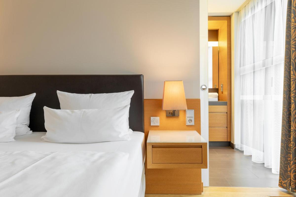 Ein Bett oder Betten in einem Zimmer der Unterkunft Schlossgut Gross Schwansee