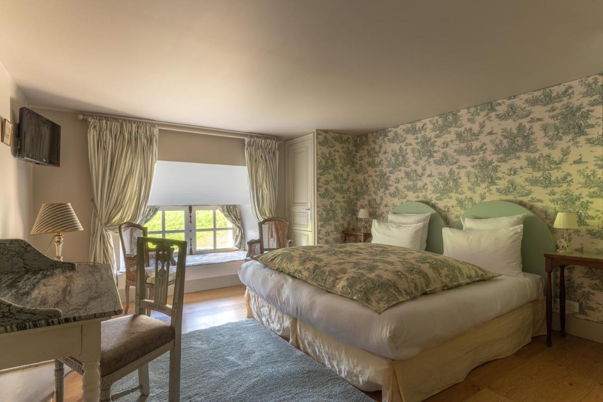 Un ou plusieurs lits dans un hébergement de l'établissement Le Château d'Etoges - Champagne