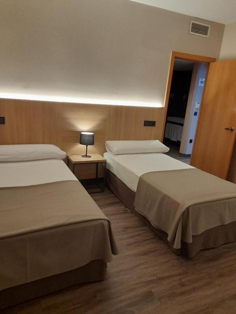 Cama o camas de una habitación en SOMMOS Hotel Benasque Spa