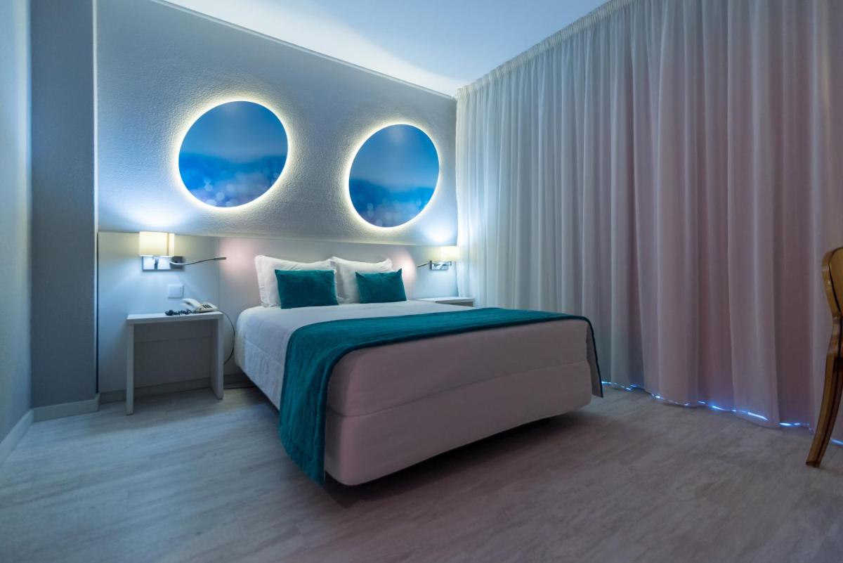 Uma cama ou camas num quarto em Hotel Costa de Prata 2 & Spa