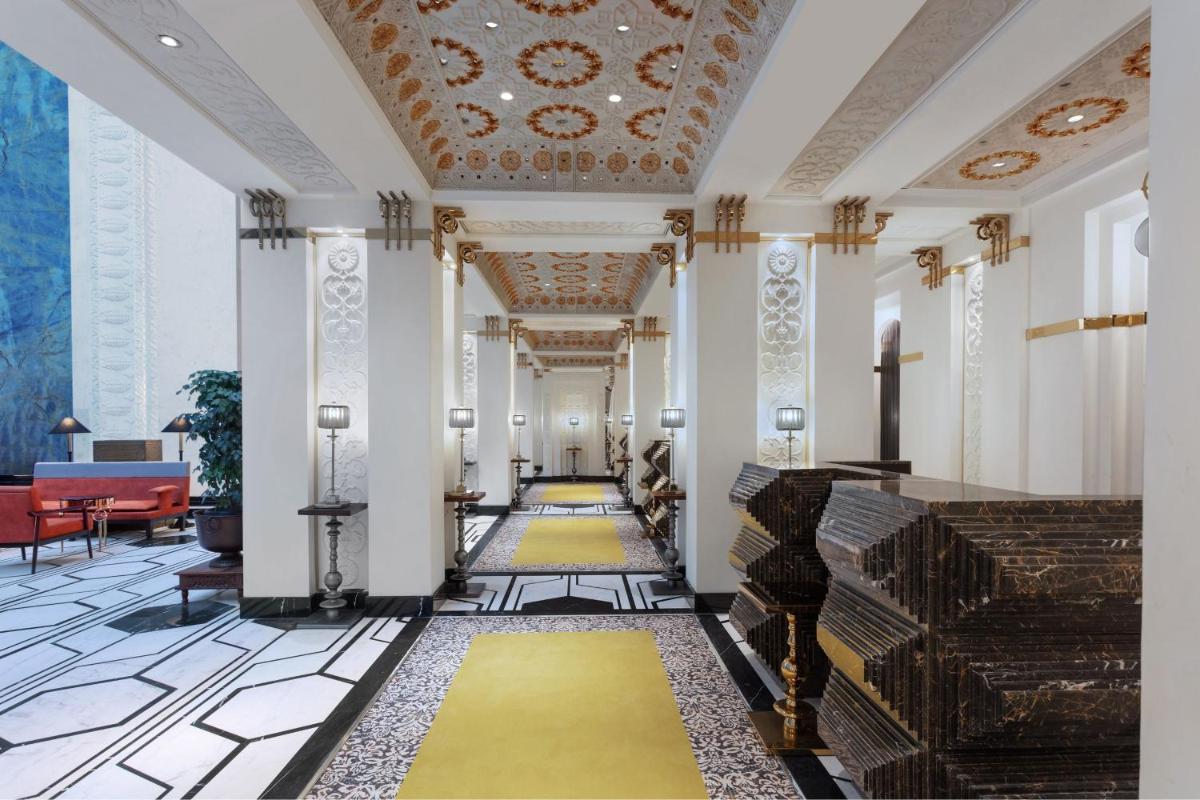 a hallway of a building with a yellow carpet at ITC Narmada, a Luxury Collection Hotel, Ahmedabad in Ahmedabad