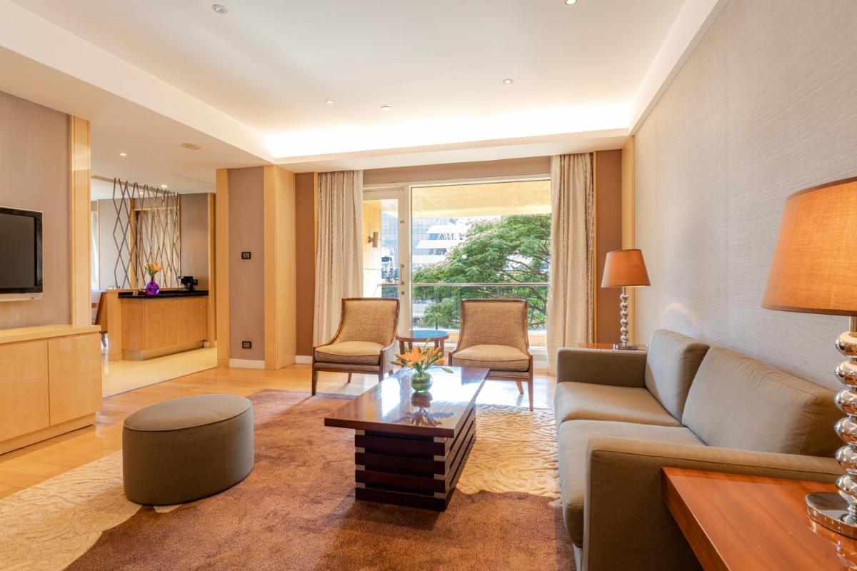 a living room with a couch and a table at Hyatt Regency Pune Hotel & Residences in Pune