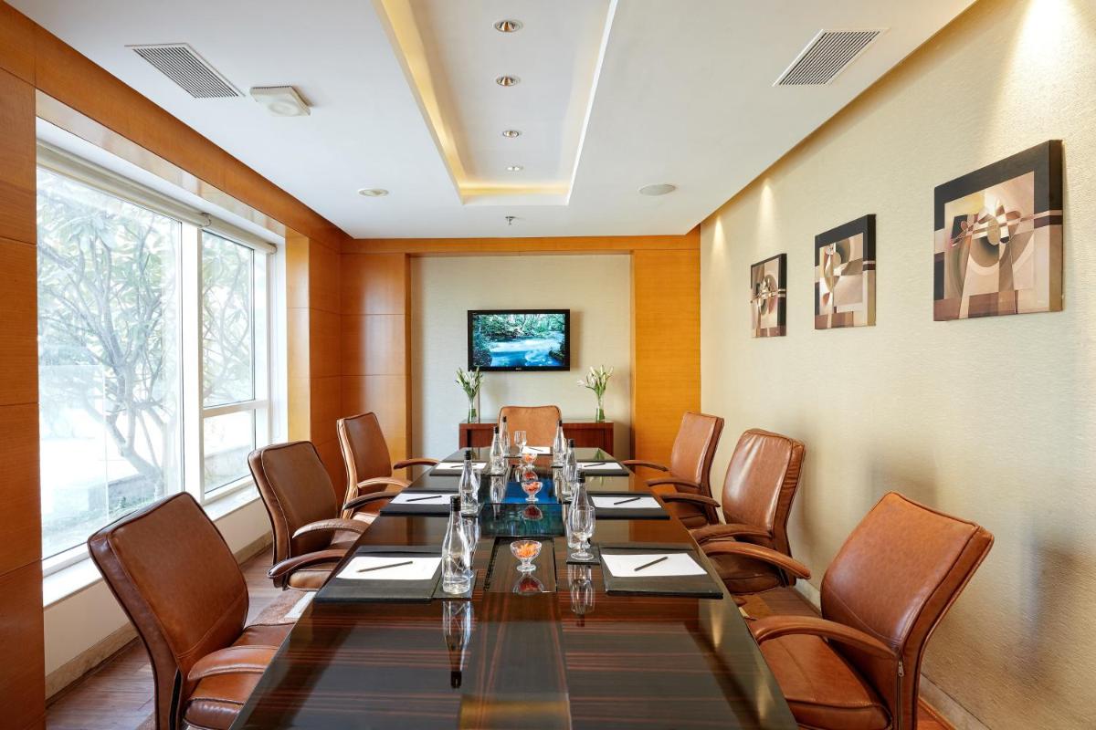 a large conference room with a long table and chairs at Hyatt Regency Pune Hotel & Residences in Pune