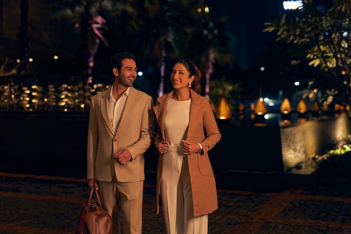 a man and a woman standing next to each other at Hyatt Regency Pune Hotel & Residences in Pune