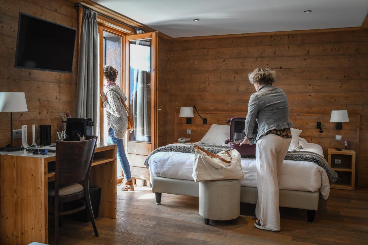 Télévision ou salle de divertissement dans l'établissement Fleur De Neige Châtel