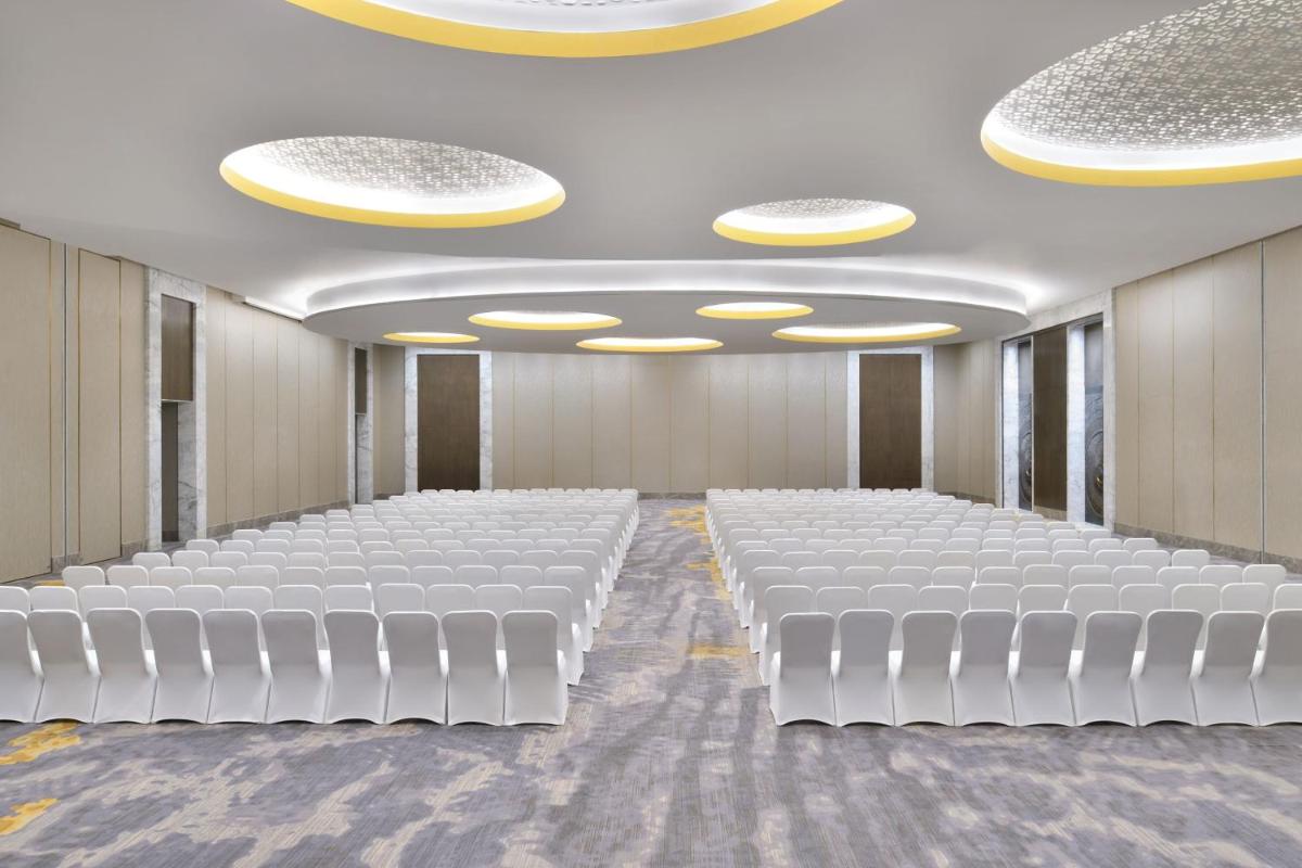 a conference room with white chairs and lights at The Westin Resort & Spa Himalayas in Rishīkesh