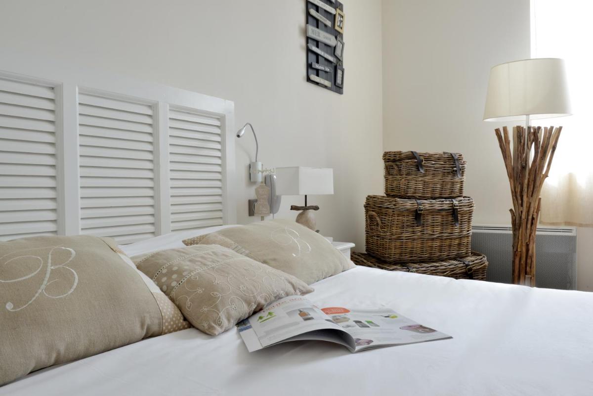 Un ou plusieurs lits dans un hébergement de l'établissement Grand Hôtel des Bains SPA