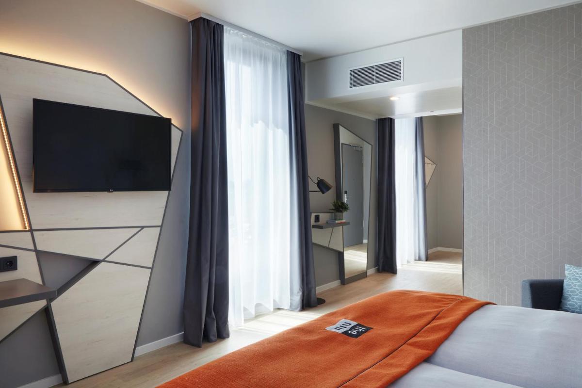 Holiday Inn - the niu, Hub Dusseldorf Messe by IHG - Housity