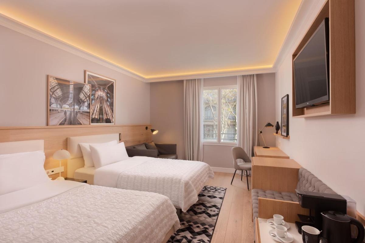 Cama o camas de una habitación en Le Meridien Barcelona